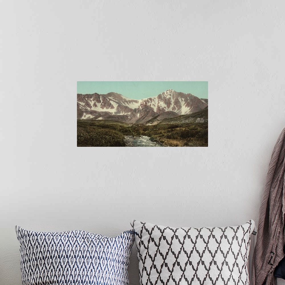 A bohemian room featuring Hand colored photograph of Colorado. Gray's and Torreyos peaks.