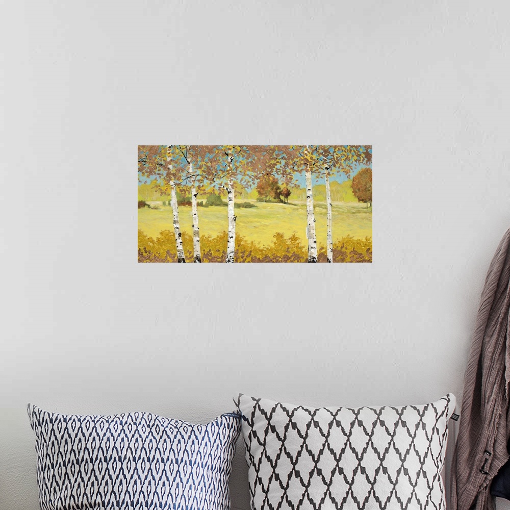 A bohemian room featuring Contemporary home decor artwork of white birch trees in a green field.