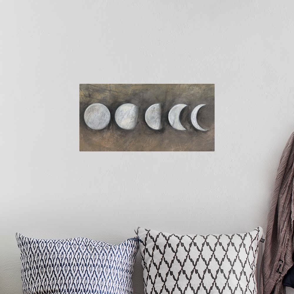 A bohemian room featuring Contemporary artwork of the moon in five phases.