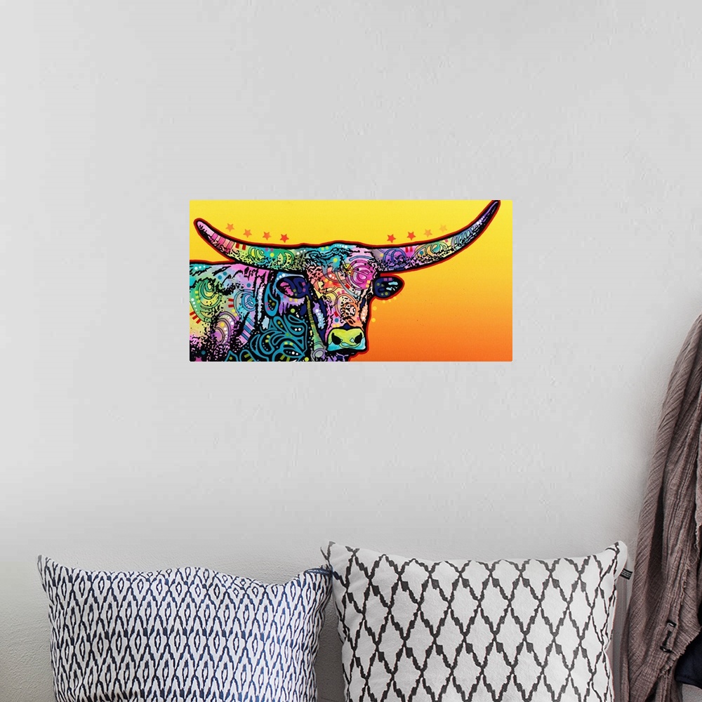 A bohemian room featuring Colorful painting of a longhorn with abstract designs on a yellow and orange gradient background.