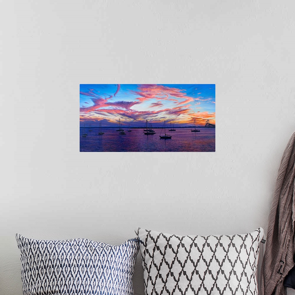 A bohemian room featuring Contemporary artwork of boats in harbor overlooking the sunset.