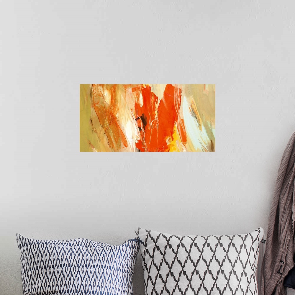 A bohemian room featuring A horizontal abstract painting in vibrant colors of orange, yellow and white.