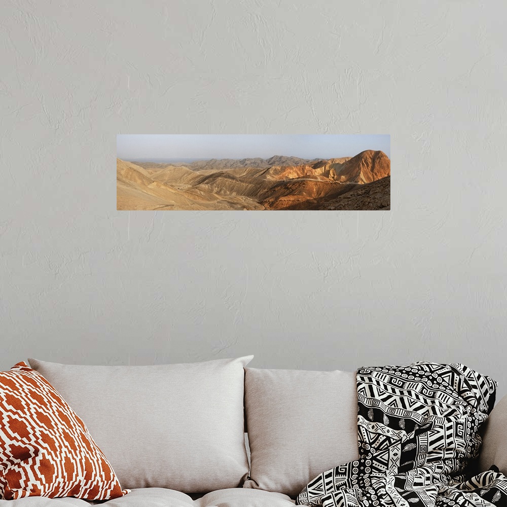 A bohemian room featuring Desert landscape panorama at sunset.