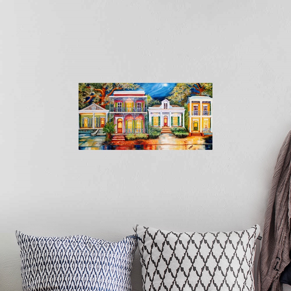 A bohemian room featuring Vibrant painting of a row of home facades in New Orleans, LA.