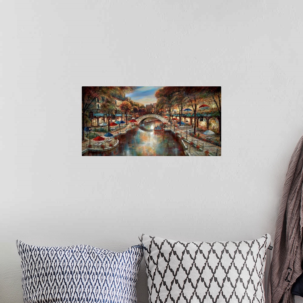 A bohemian room featuring Contemporary artwork of a city scene in the evening with a canal running through the town.