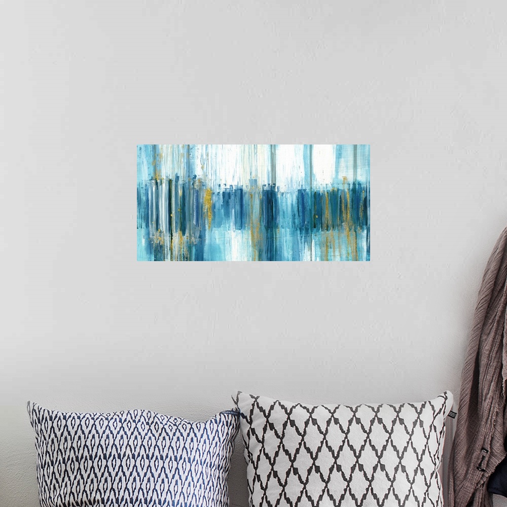 A bohemian room featuring Large abstract painting with blue brushstrokes in shades of blue running vertically down the canv...