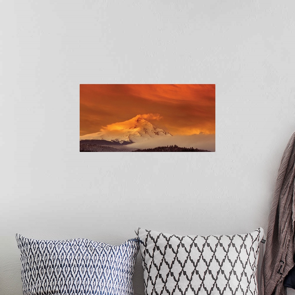 A bohemian room featuring Clouds covering the snowy peak of Mount Hood at sunset.