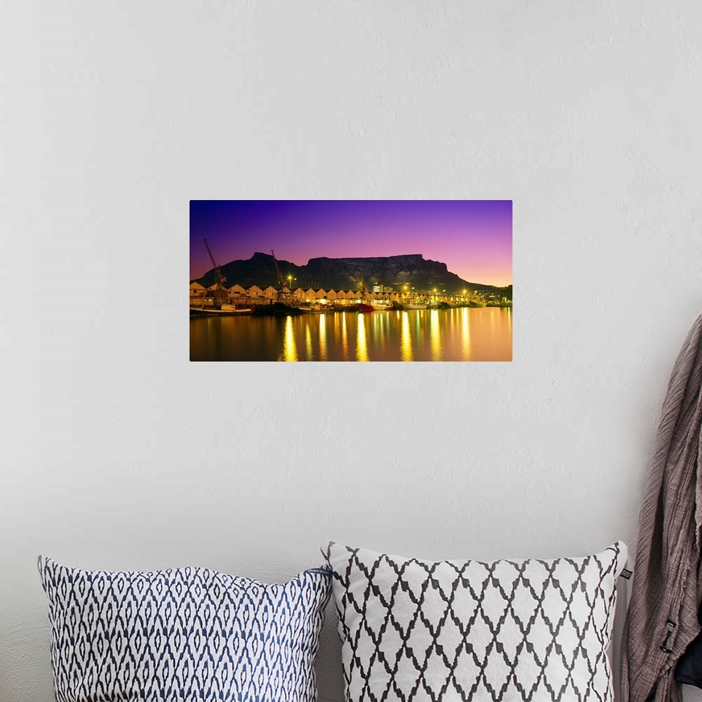 A bohemian room featuring Night lights of Cape Town Harbour at sunset. V
