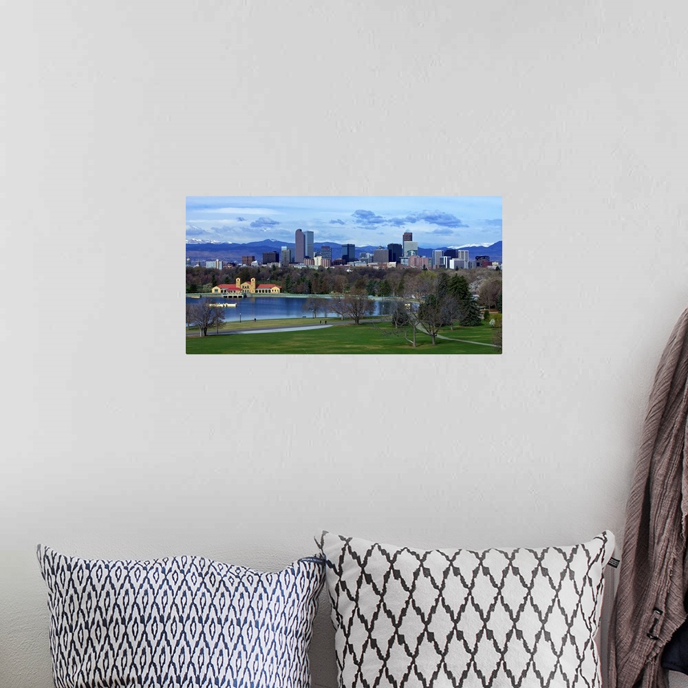 A bohemian room featuring Denver Skyline from City Park with boat house and lake and Mt. Evans in background.