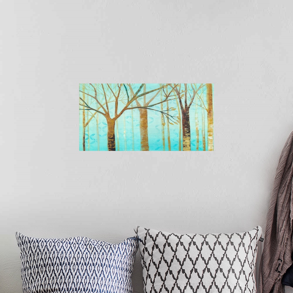 A bohemian room featuring Contemporary artwork of brown trees against a teal background sky.
