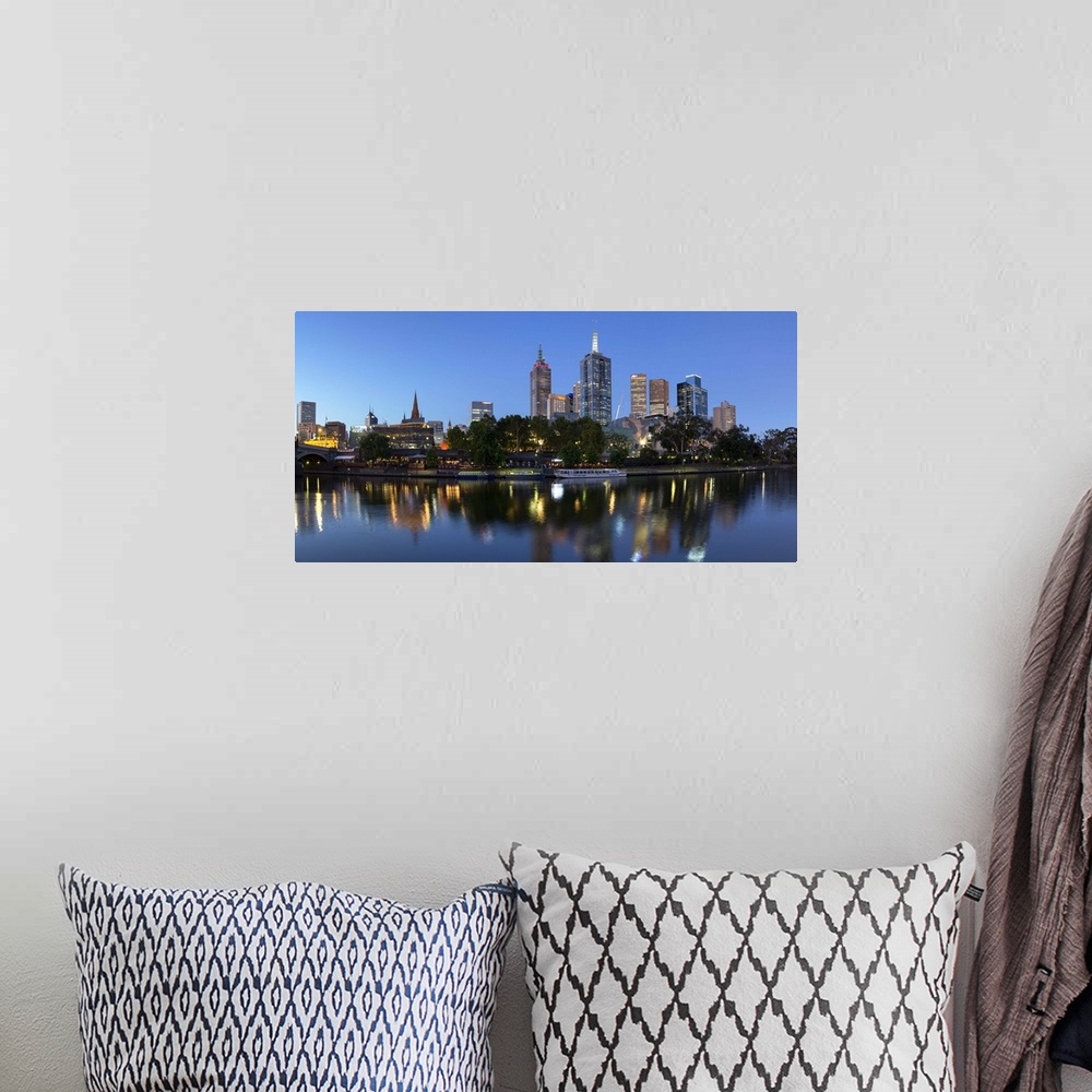 A bohemian room featuring Melbourne skyline along Yarra River at dusk, Melbourne, Victoria, Australia.