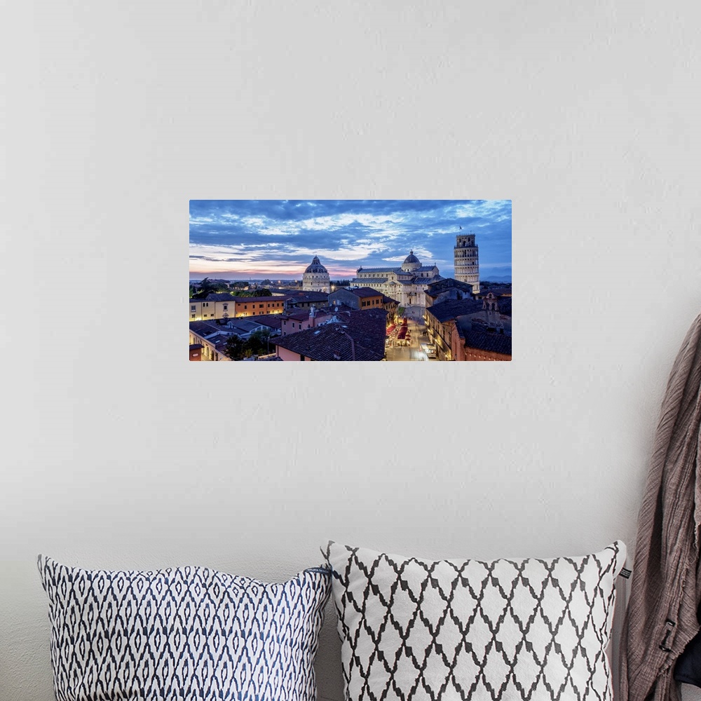 A bohemian room featuring View over Via Santa Maria towards Cathedral and Leaning Tower at dusk, Pisa, Tuscany, Italy.
