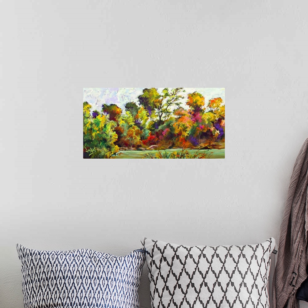 A bohemian room featuring Contemporary painting of a scenic view of a forest in mid color change from the seasons changing.