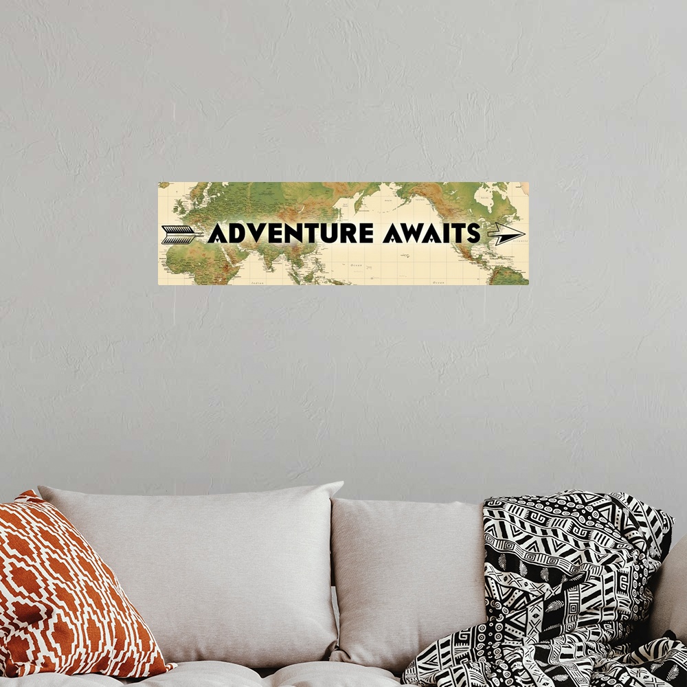 A bohemian room featuring "Adventure Awaits" written over a map of the world, with an arrow motif.