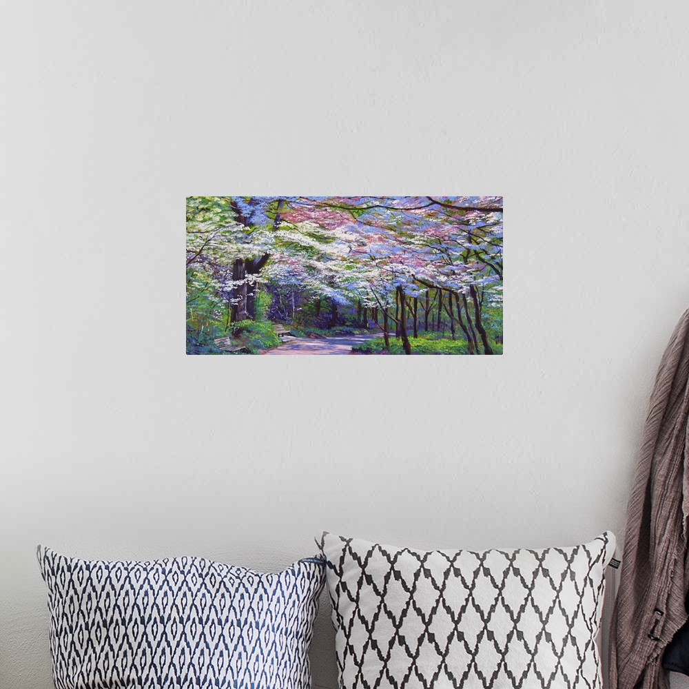 A bohemian room featuring Painting of a path full of trees in full bloom with white and pink flowers.