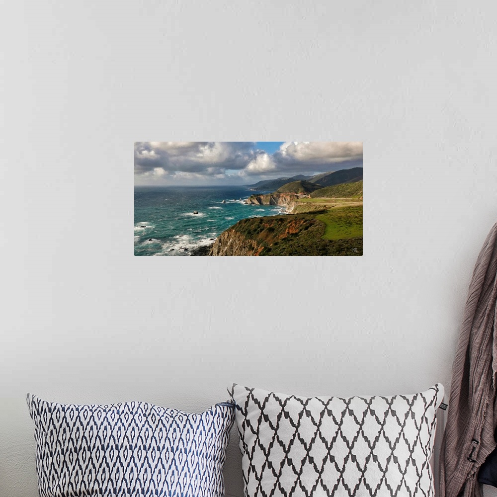 A bohemian room featuring A view of the Big Sur coastline from Hurricane Point, with the Bixby Creek Bridge glowing in the ...