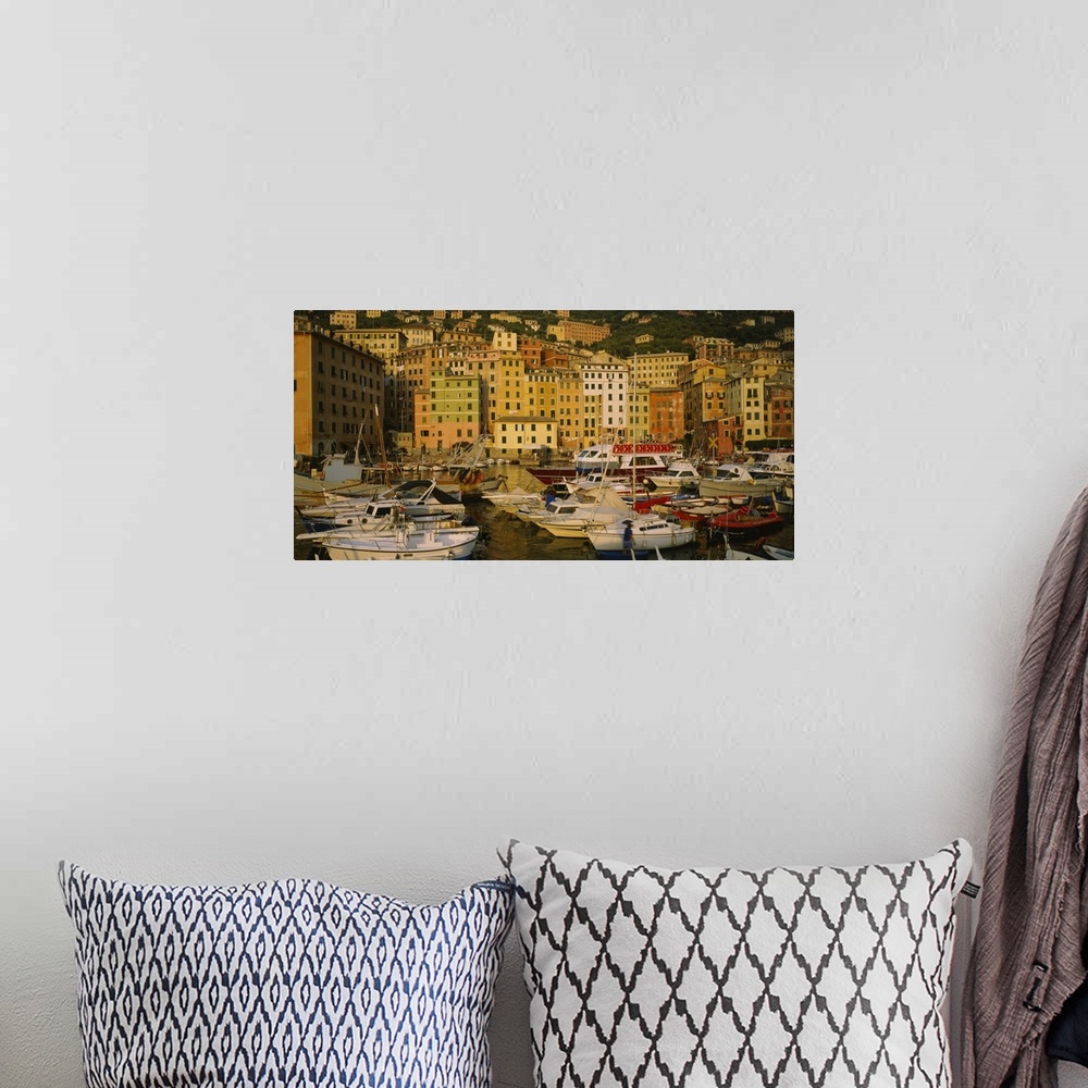 A bohemian room featuring Big canvas photo art of boats in the harbor with tall buildings on a hill in the background reach...