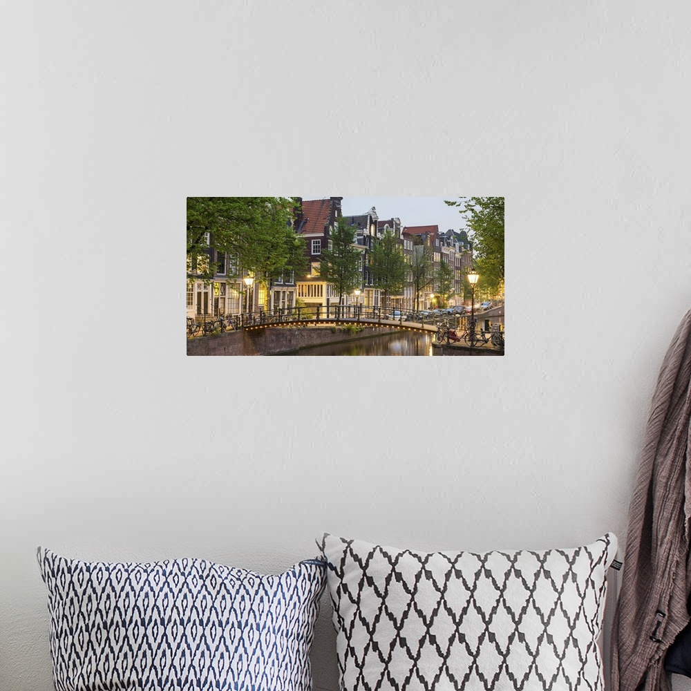 A bohemian room featuring Bridge over Brouwersgracht in western Grachtengordel canal ring at dusk, Amsterdam, North Holland...