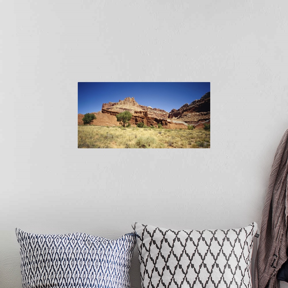 A bohemian room featuring Rock formations on a landscape, Canyon De Chelly, Arizona