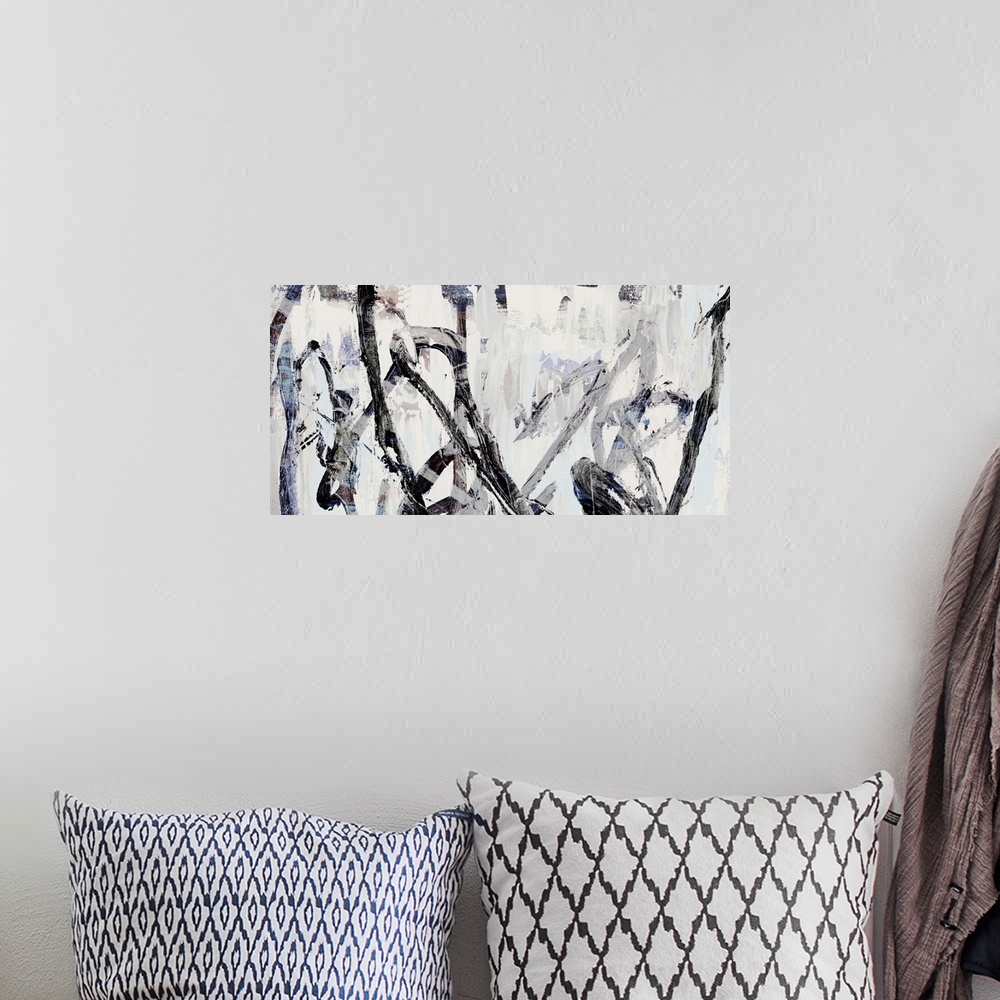 A bohemian room featuring Contemporary abstract artwork in shades of grey and black.