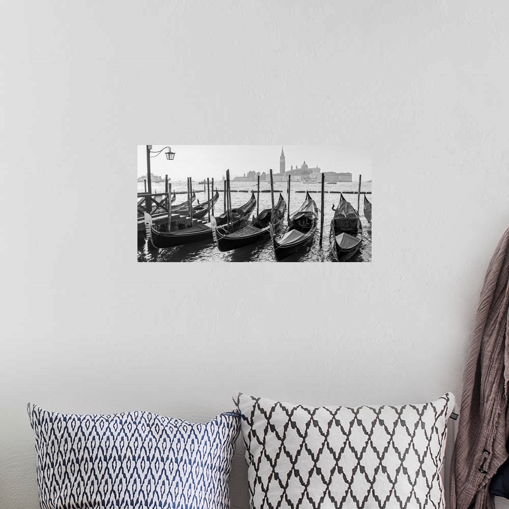 A bohemian room featuring Black and white photograph of a row of gondolas in front of Piazza San Marco (St. Mark's Square) ...