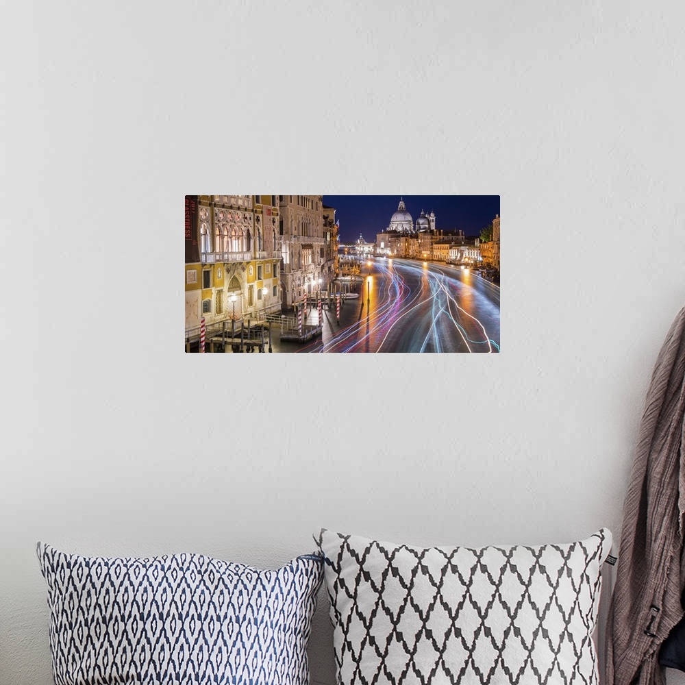 A bohemian room featuring Long exposure photograph of the Grand Canal in Venice lit up at night with light trails from wate...