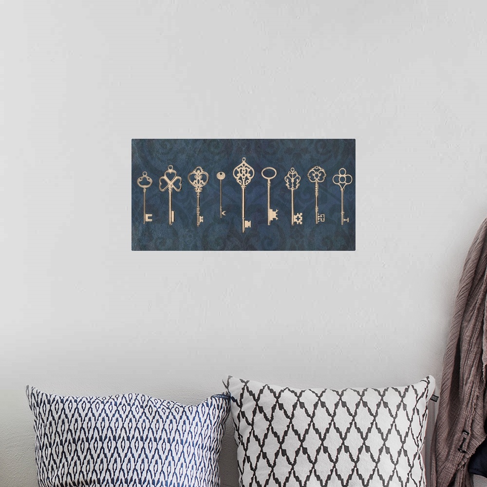A bohemian room featuring An assortment of vintage keys with ornate designs arranged in a row on a navy blue background.