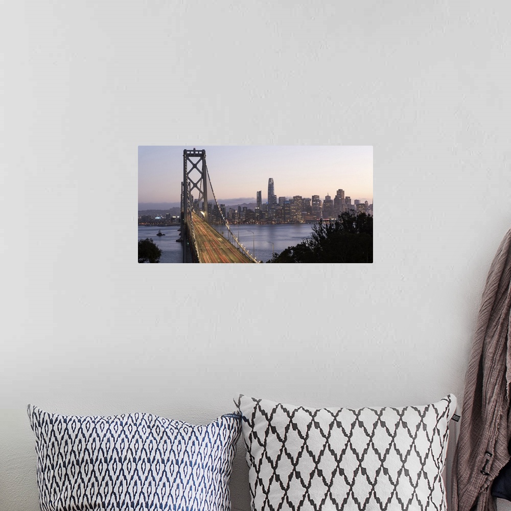 A bohemian room featuring Photograph of the Bay Bridge with a pink and purple sunset and the San Francisco skyline lit up i...