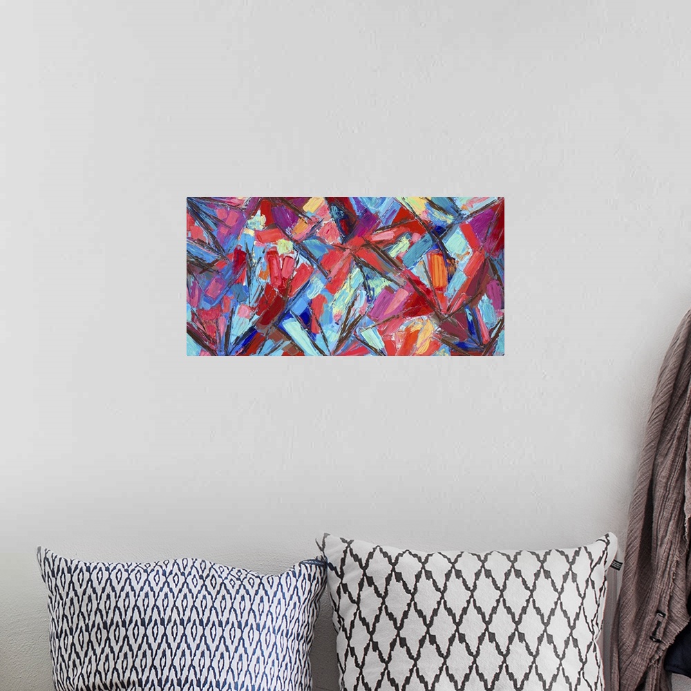 A bohemian room featuring Vivid blue and red abstract artwork.