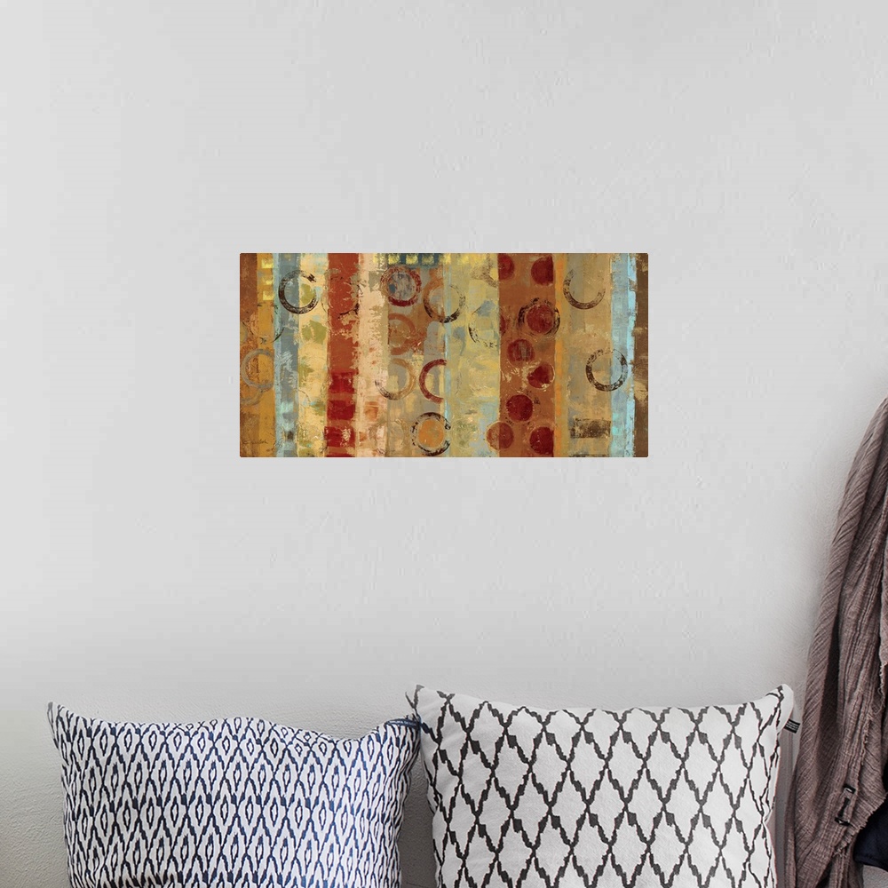 A bohemian room featuring Abstract art featuring lines of color interspersed with circular shapes and designs.