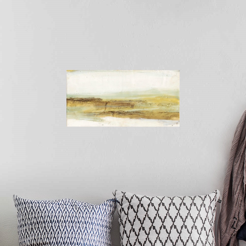 A bohemian room featuring An abstract painting in warm gold and mint colors representing a horizon under a neutral sky