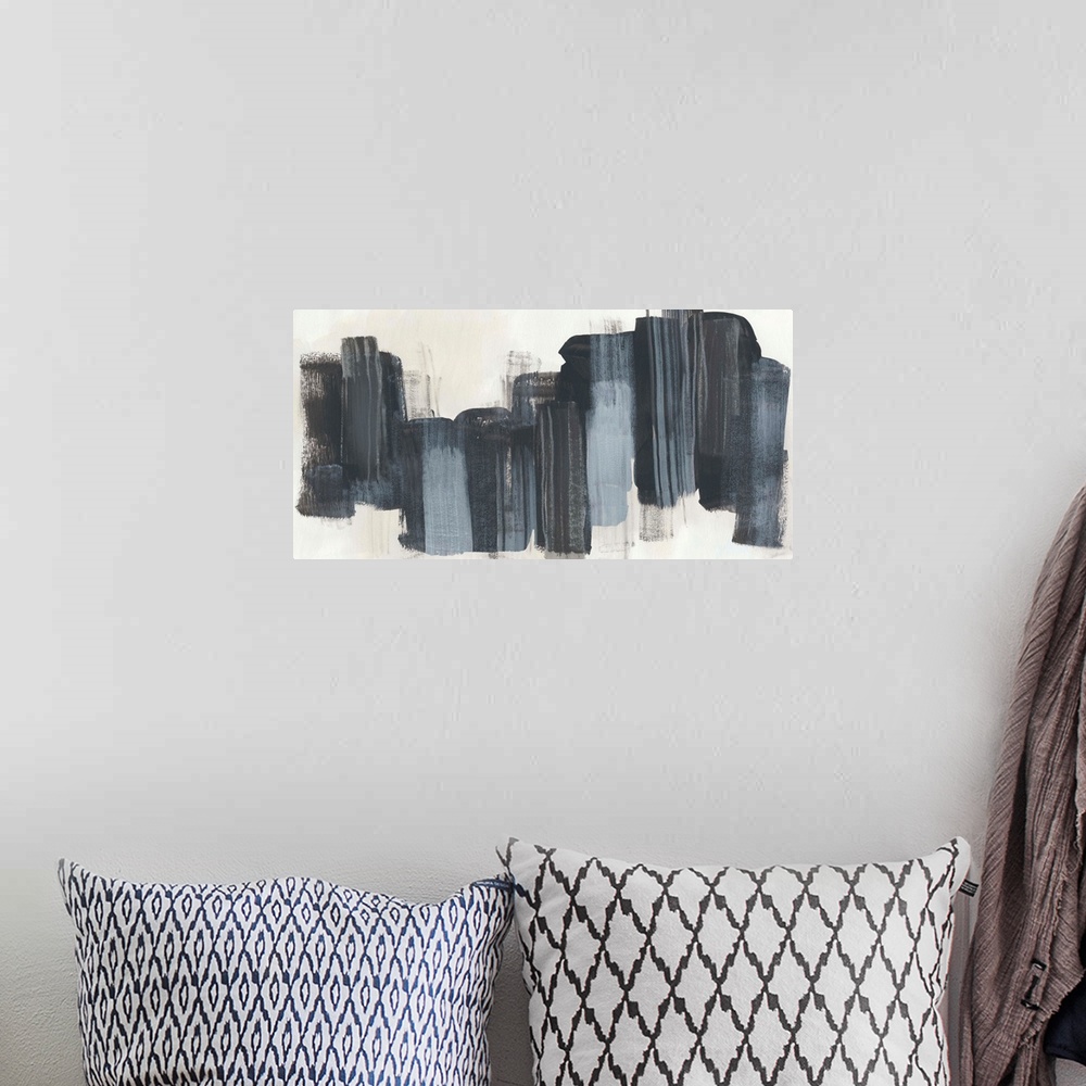 A bohemian room featuring Horizontal abstract artwork in dark grey blocks on beige.