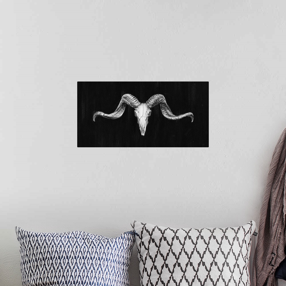 A bohemian room featuring Contemporary artwork of a ram skull against a dark background.