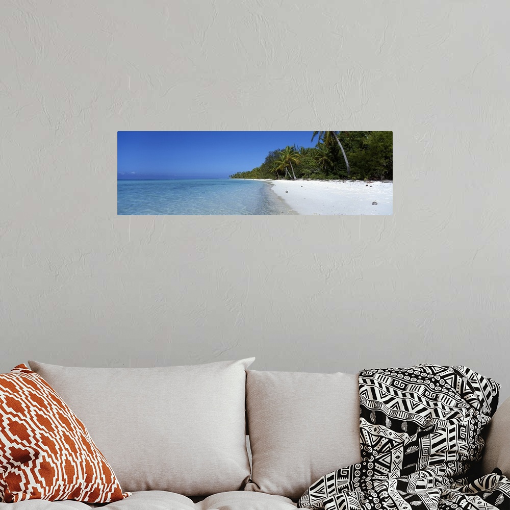 A bohemian room featuring Panoramic photograph of clear blue waters over the atoll near Beach Tetiaroa in Tahiti.  The beac...