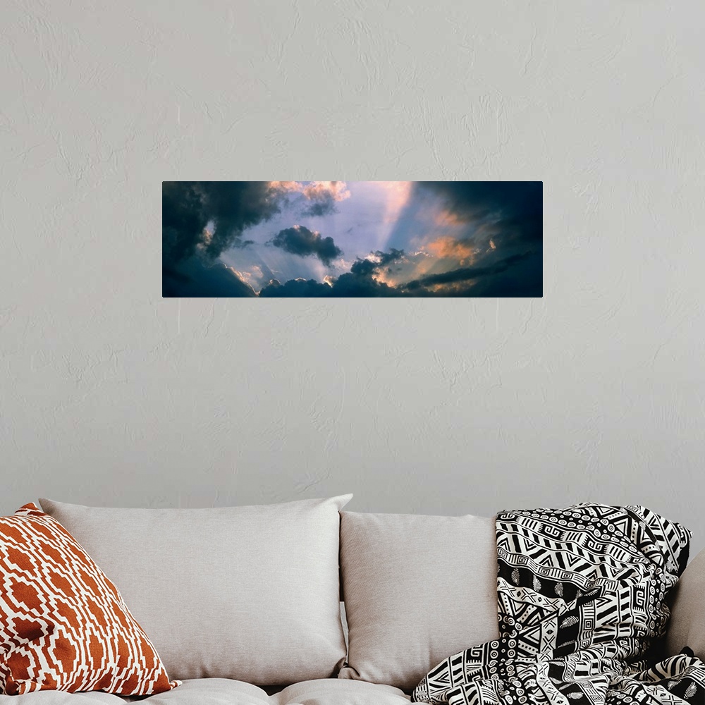 A bohemian room featuring Clouds w/ God rays