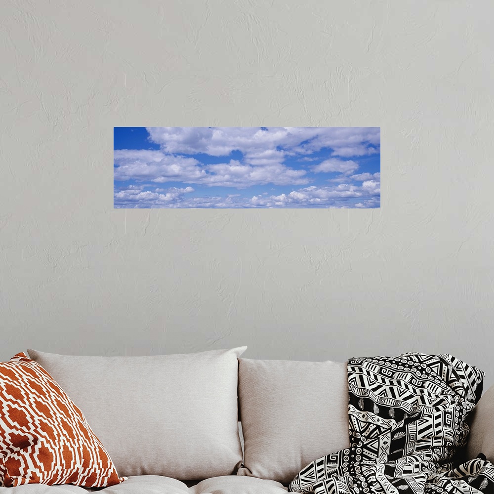 A bohemian room featuring Cumulus Clouds Blue Sky