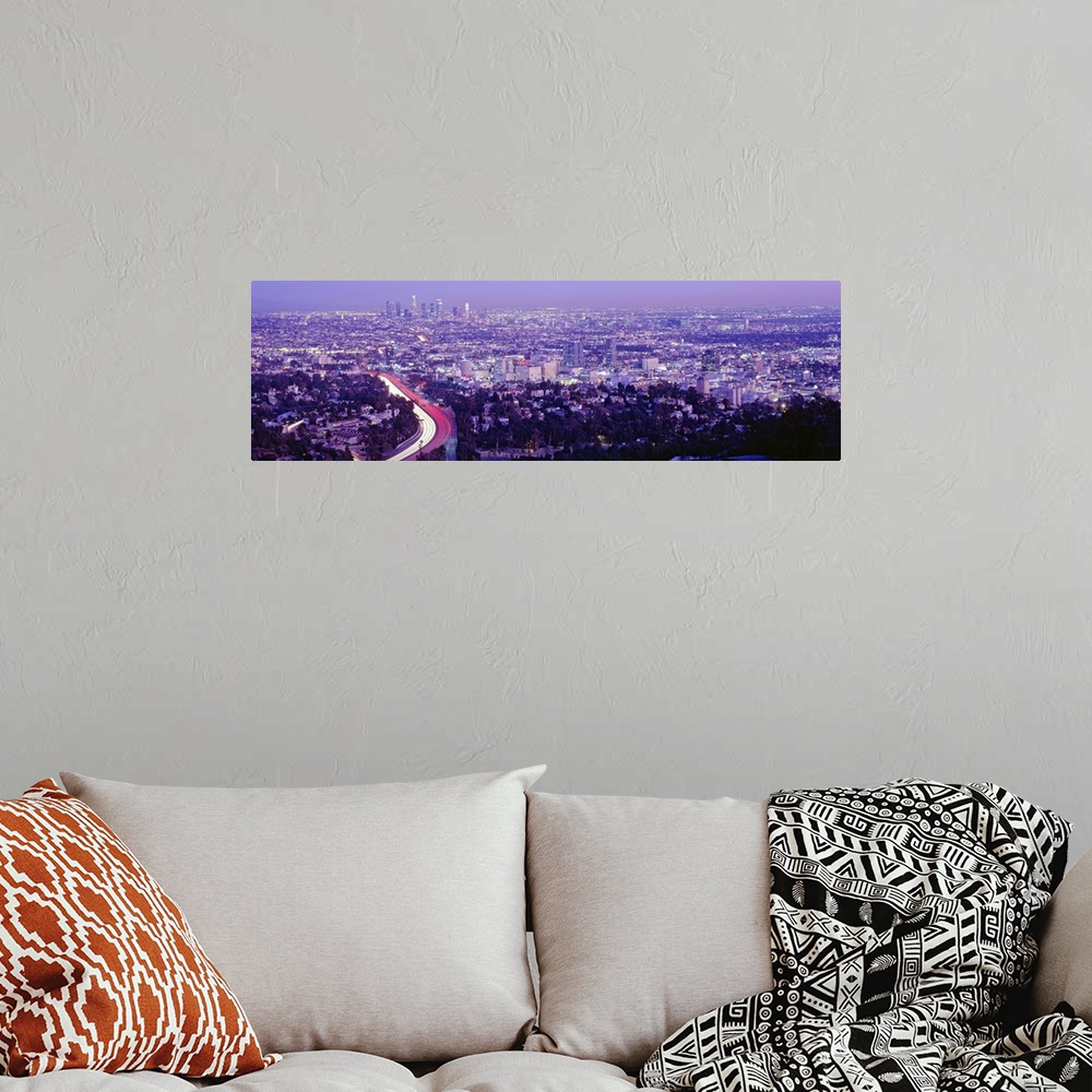 A bohemian room featuring Wide angle, aerial photograph of the vast city of Los Angeles, California, beneath a clear sky.