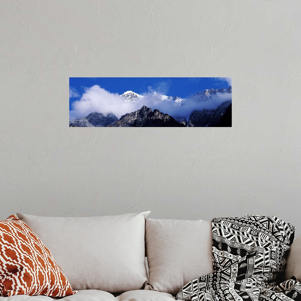 A bohemian room featuring Nepal, Manaslu Trek, Low angle view of clouds around mountain peaks