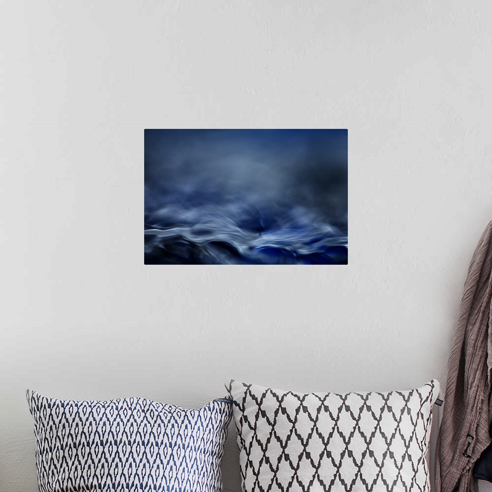 A bohemian room featuring Abstract digital art resembling  a moving water landscape.