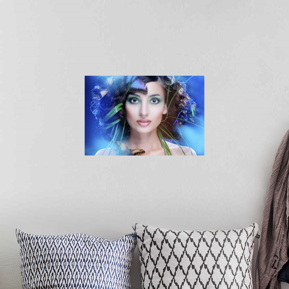 A bohemian room featuring Artistic portrait of a beautiful woman with green reeds and blue butterflies around her face.