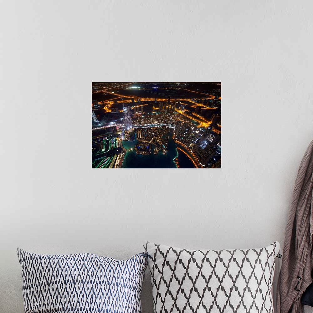 A bohemian room featuring Glowing cityscape view of Dubai at night.