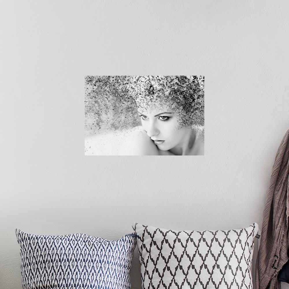 A bohemian room featuring Black and white portrait of a woman with a rusted texture.