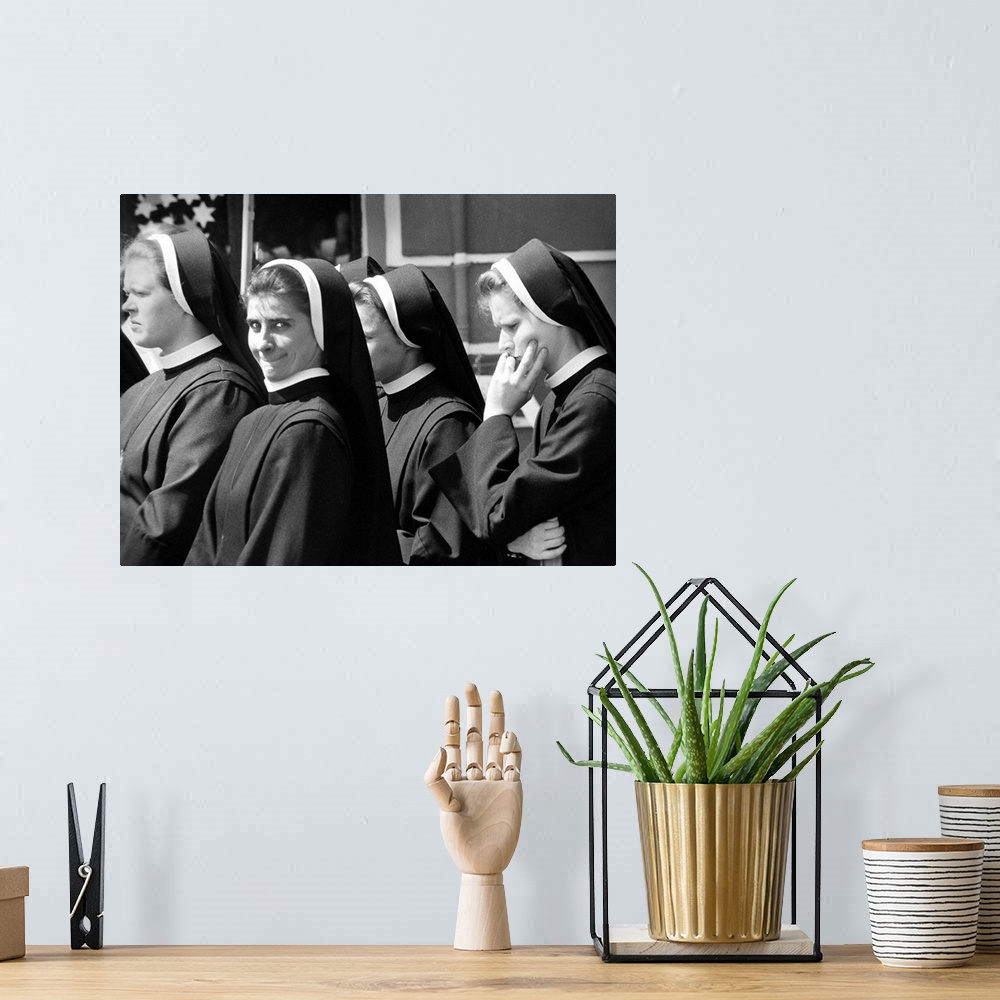 A bohemian room featuring A group of nuns walking in the street with one smiling, Poland.