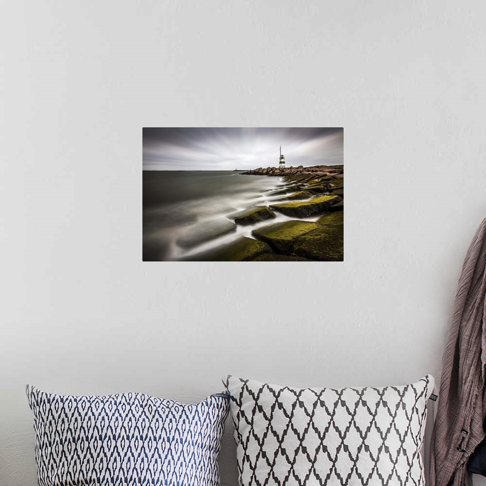 A bohemian room featuring Lighthouse on the rocky moss covered shoreline of IJmuiden, Netherlands.