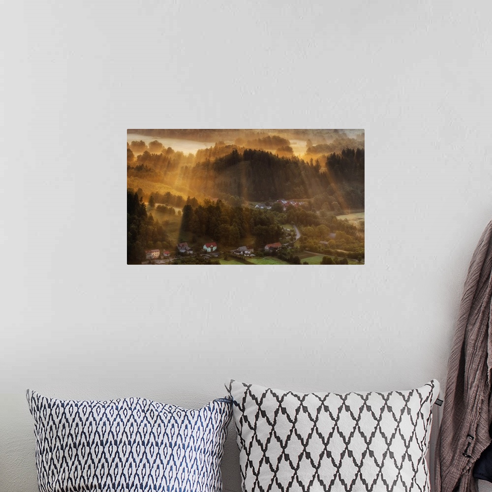 A bohemian room featuring A photograph of Polish countryside landscape bathed in early morning light.