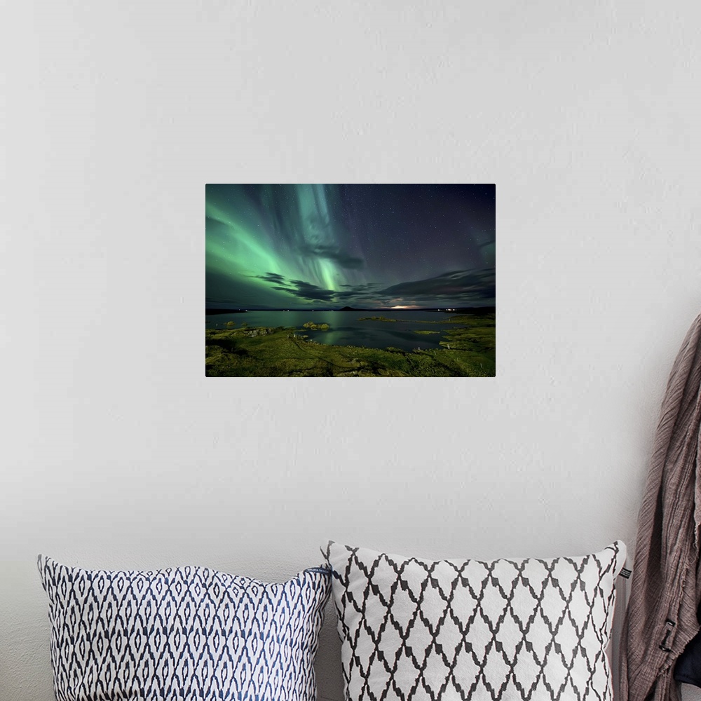 A bohemian room featuring The northern lights seen above Myvatn Lake in Iceland at night.