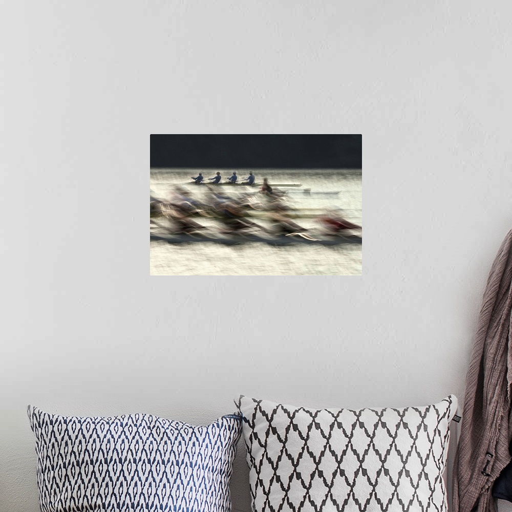 A bohemian room featuring Long exposure photograph of rowing teams in a lake.