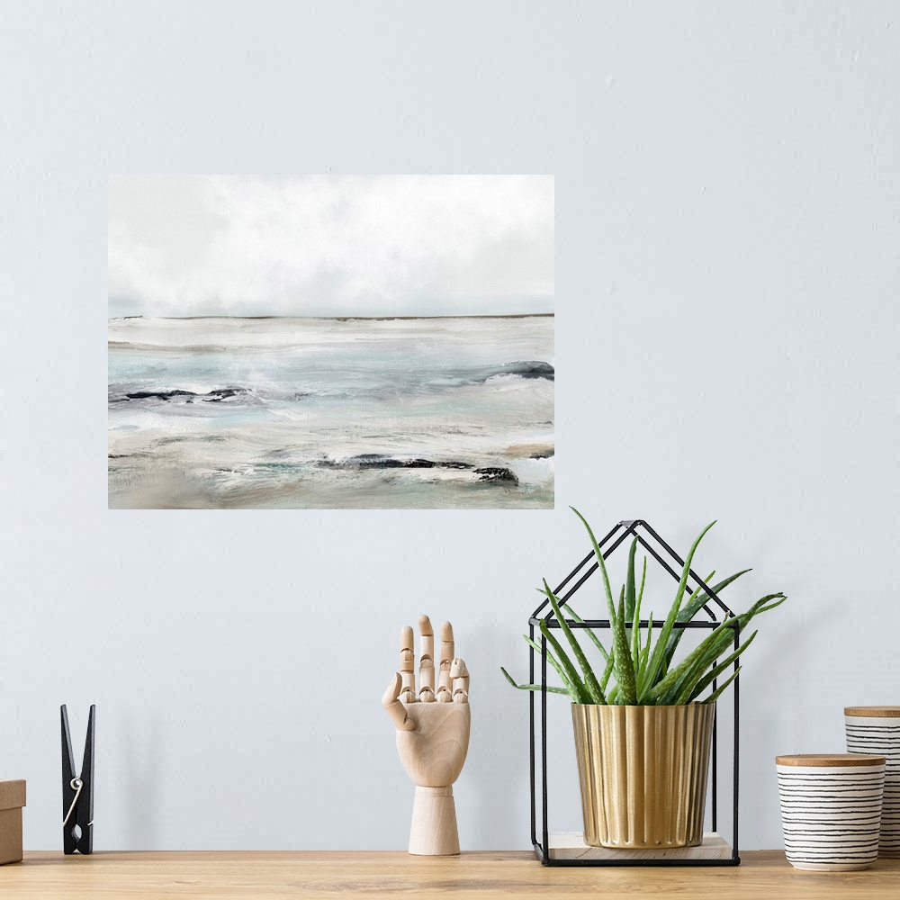 A bohemian room featuring A contemporary abstract seascape with waves washing over dark rocks under a grey sky. Perfect for...