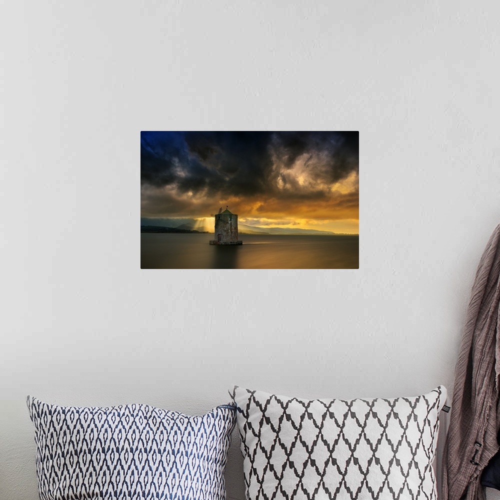 A bohemian room featuring Landscape photograph of calm water and a dramatic sky in Italy.