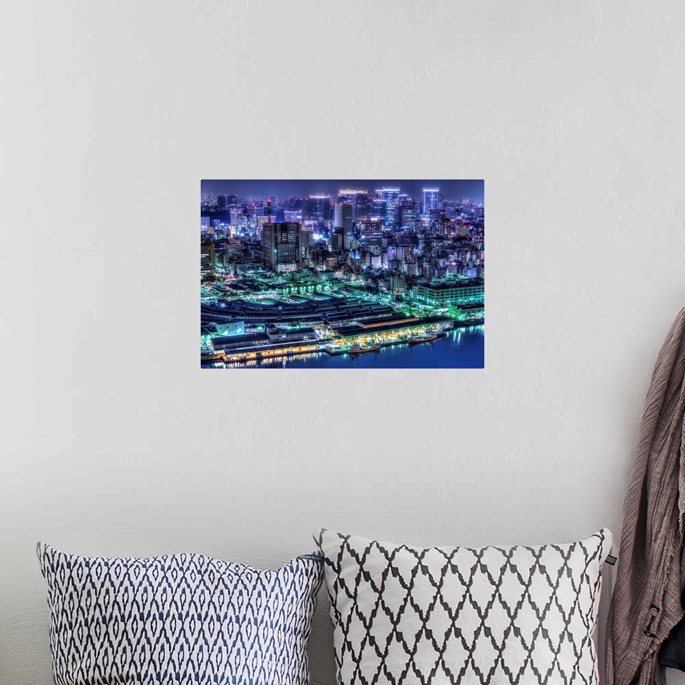 A bohemian room featuring A photograph of the cityscape of Tokyo at night lit up in neon lights, Japan.